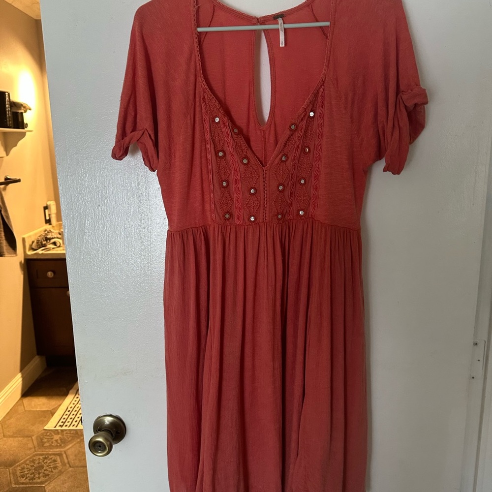 Elegant Coral Dress with Embellished Neckline